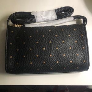 Small black w/gold stars on it “jewel” genuine leather, new w/ dust bag